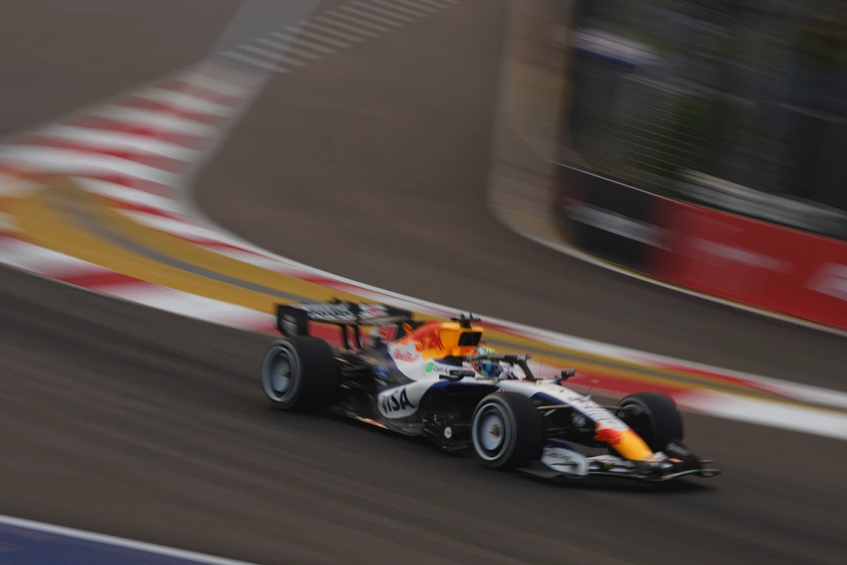 White Racing Bulls car panned against blurred corner markings at the Singapore GP